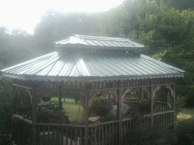 Two tier green metal roof on a garden gazebo in Hyannis